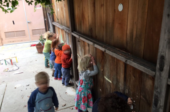 Covered fence peepholes for kids