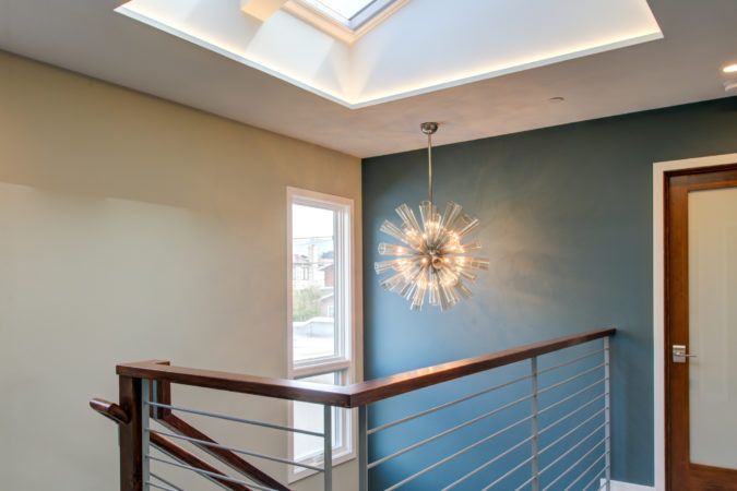 Warm Modern new daylit staircase chandelier